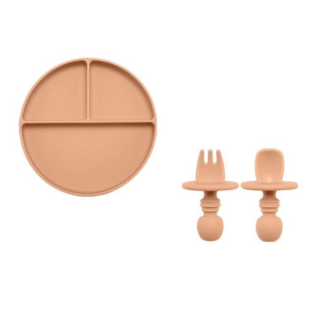 Weaning essentials: a beige silicone divided plate and utensil set for young children