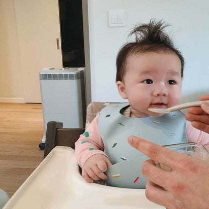 Adjustable silicone baby bib in blue, featuring easy-clean material for stress-free weaning