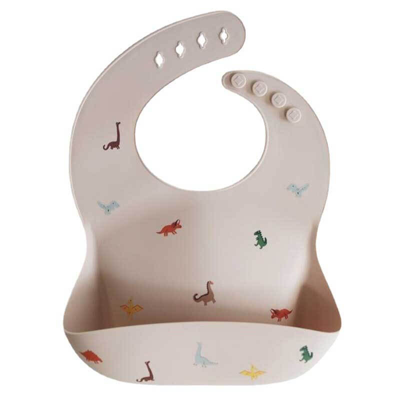 Mess-free feeding with a yellow silicone baby bib, designed for easy clean-up after toddler meals
