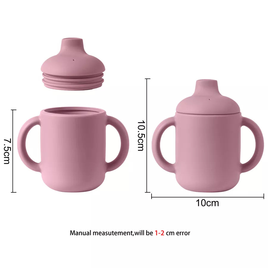 Infant silicone drinking cup in a cute design, ideal for baby feeding and learning.