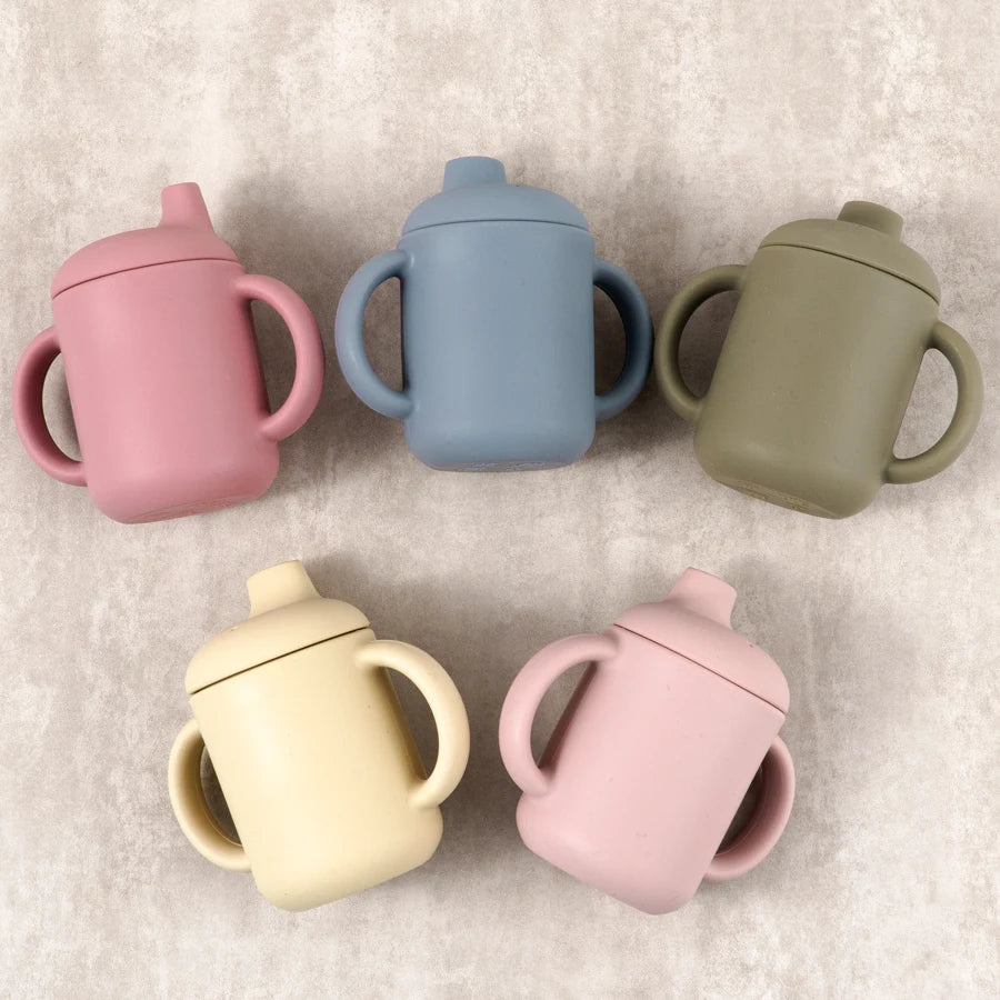 Colorful silicone sippy cup for babies, designed for easy drinking and spill prevention.