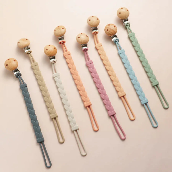 Baby silicone pacifier clip & teether, BPA-free, colorful design for infants.