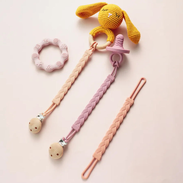 Vibrant silicone teether clip, safe for newborns and teething babies alike.