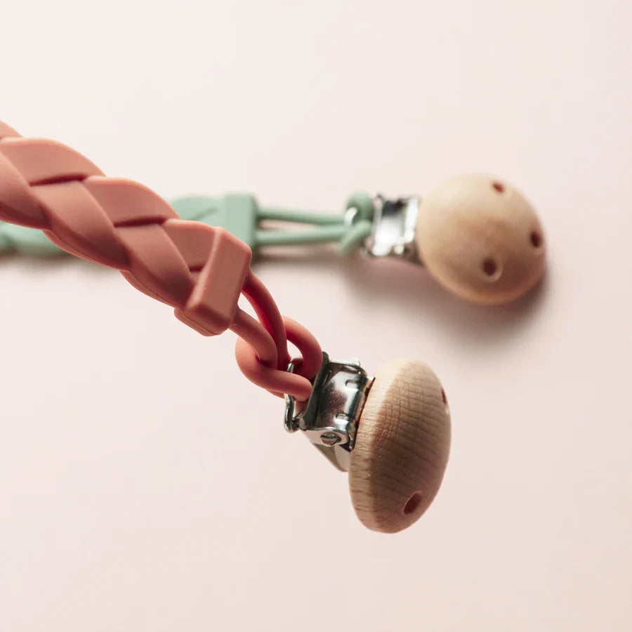 Infant pacifier holder & teether, flexible silicone, prevents drops, teething relief.