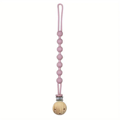 Pink silicone pacifier clip with a round teether, a cute and functional infant accessory.