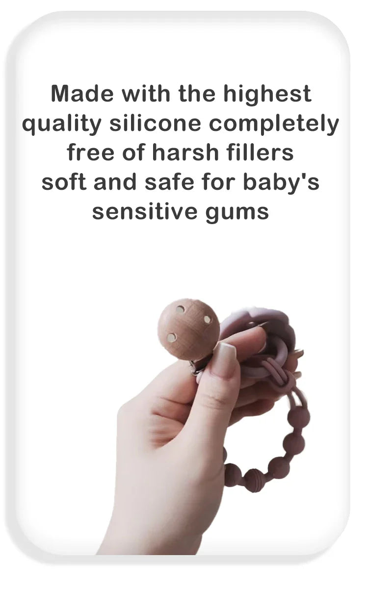 Baby pacifier clip in a neutral color with a silicone teether, blending style and utility.