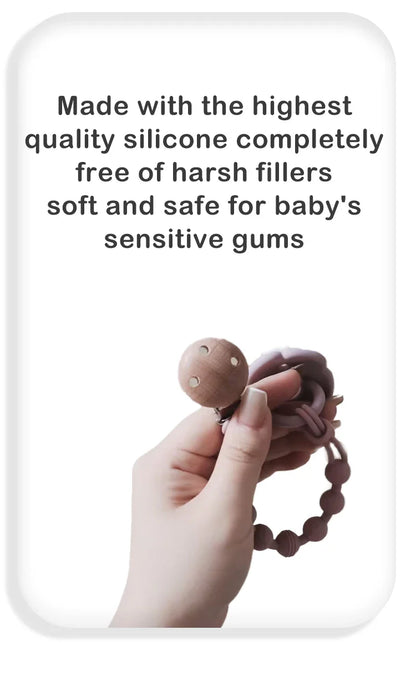 Baby pacifier clip in a neutral color with a silicone teether, blending style and utility.