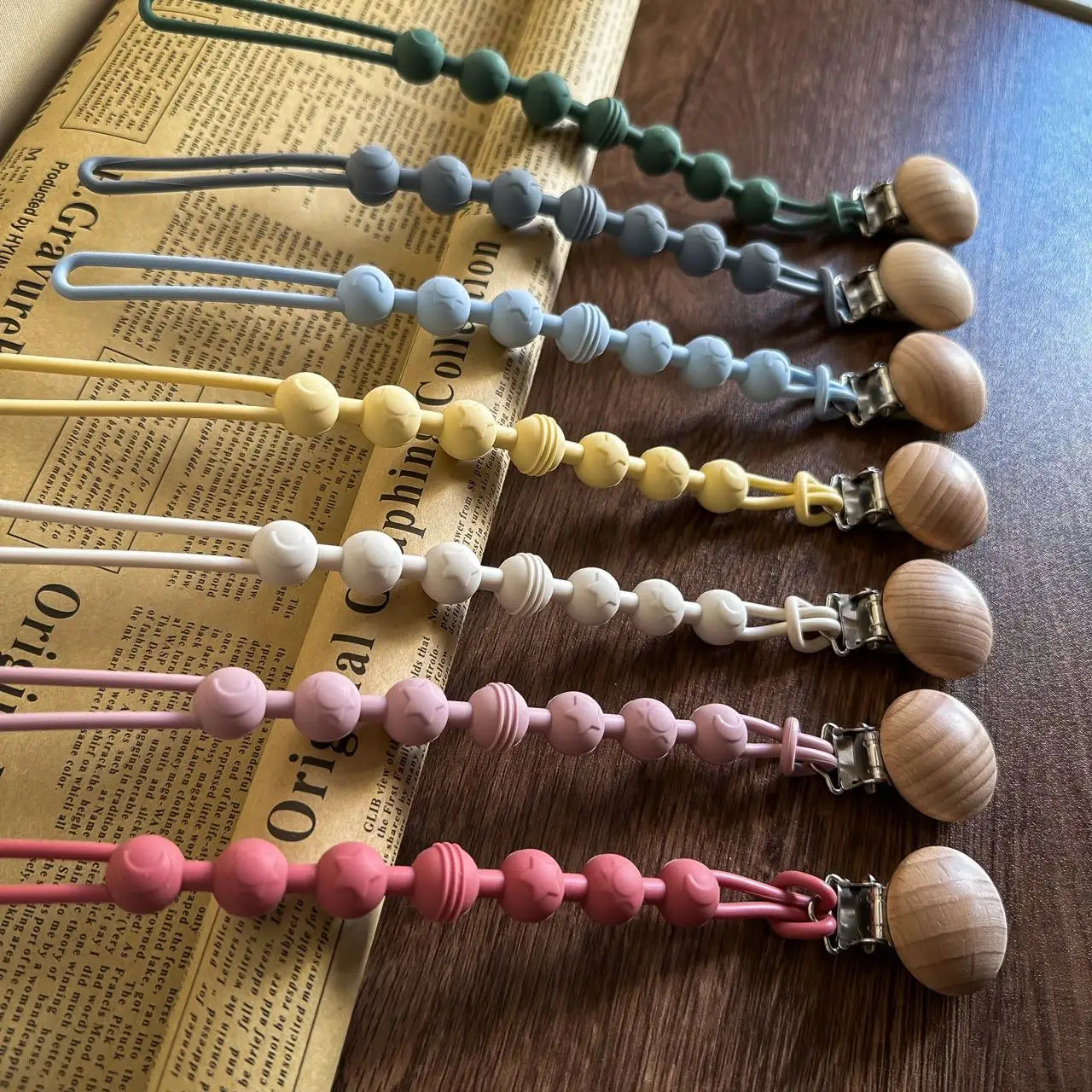High-quality silicone pacifier clip with a chewable teether, designed for baby safety.