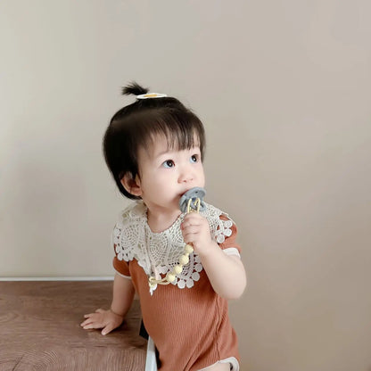 Modern design silicone pacifier clip with an integrated teether, a smart infant accessory.