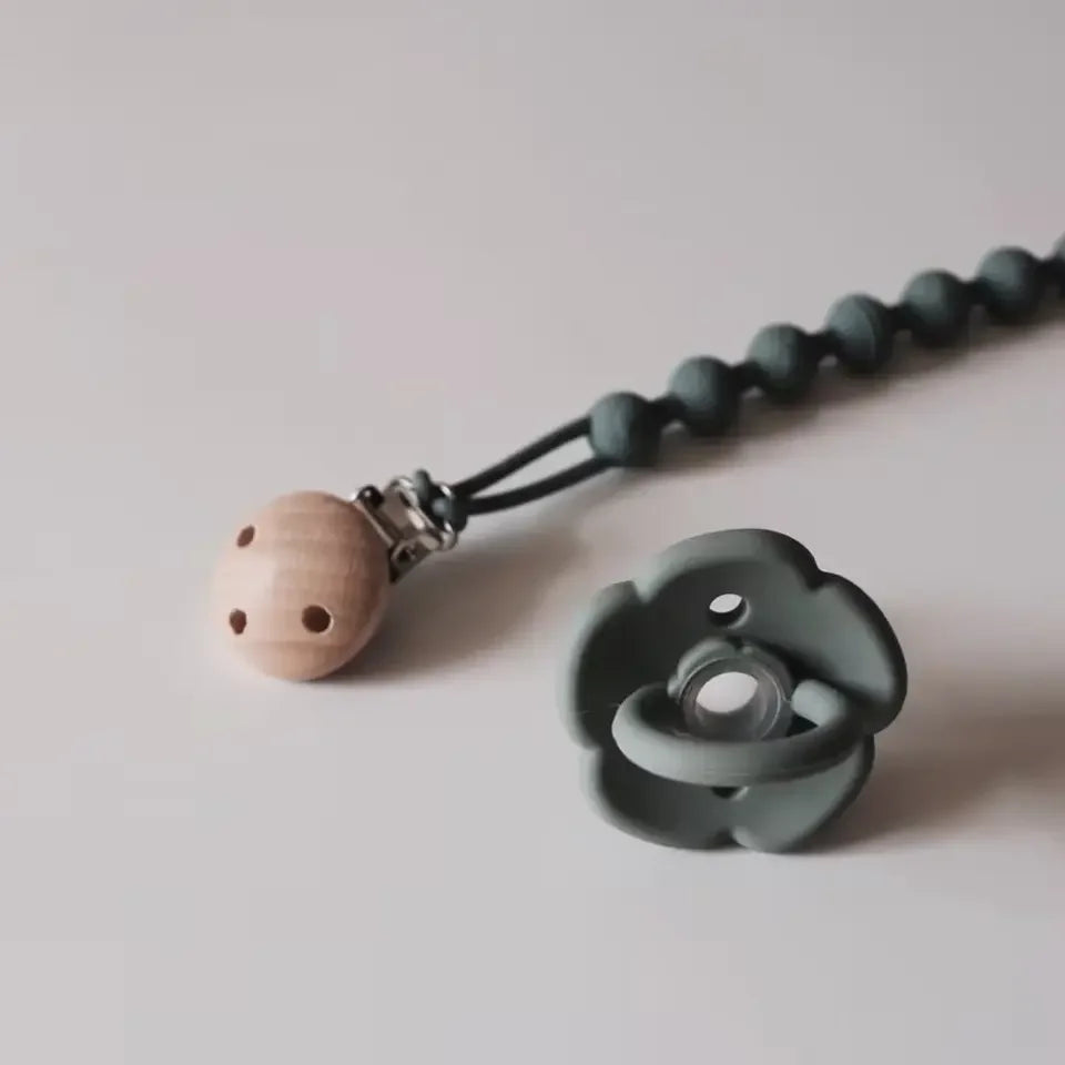 Practical baby essential: silicone pacifier clip with an easy-to-grab teether for little hands.