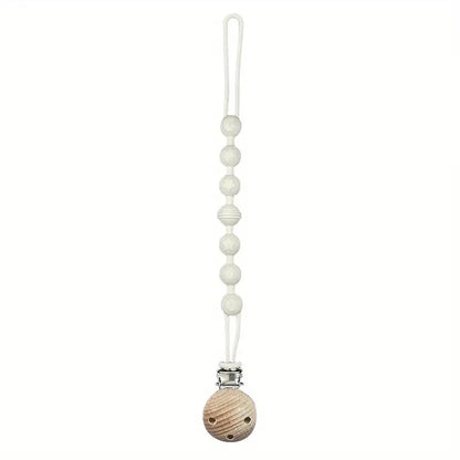 Pacifier holder and teether combo, made from food-grade silicone for baby's safety.