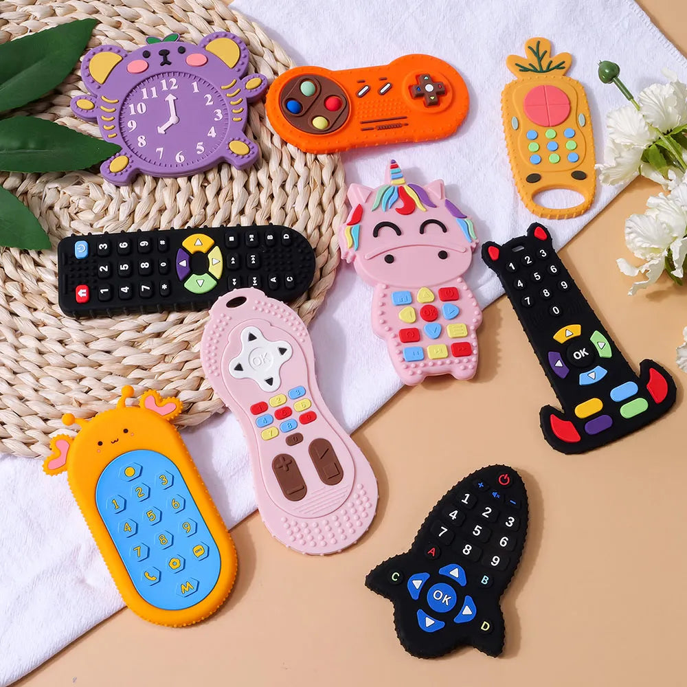 Pile of multi-colored silicone remote control teethers for baby gum relief