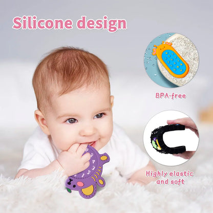 Child exploring a yellow silicone remote control teether, enhancing motor skills