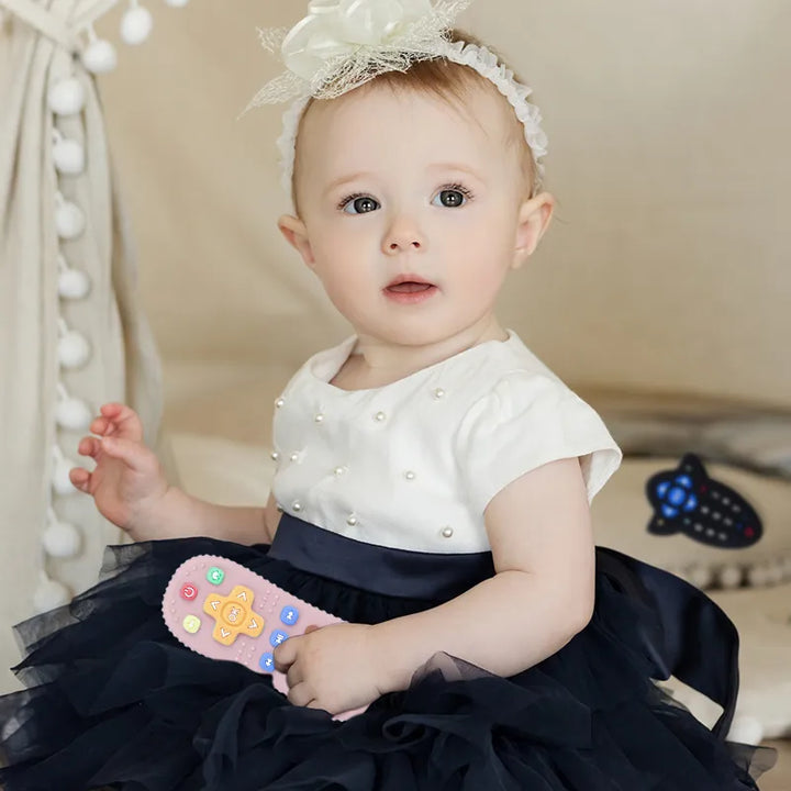 Yellow silicone remote control teether, lightweight and easy for babies to hold