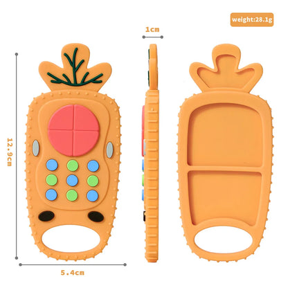 Infant reaching for a bright orange silicone remote control teether, teething aid