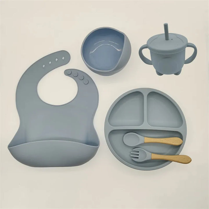 Baby gift idea: complete silicone self-feeding tableware set. Non-slip design for easy mealtime.