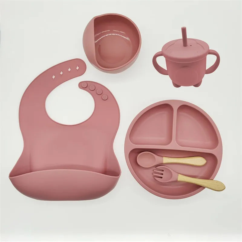 Kids dinnerware: durable silicone self-feeding set. Includes suction base plate, bowl, & bib.