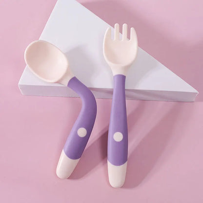 Toddler self-feeding fork, silicone, orange, with short handle for easy maneuverability