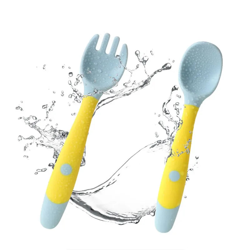 Ergonomic baby fork from silicone set, yellow, designed for toddlers learning to self-feed