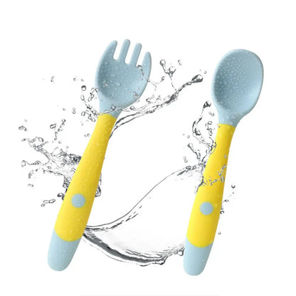 Ergonomic baby fork from silicone set, yellow, designed for toddlers learning to self-feed