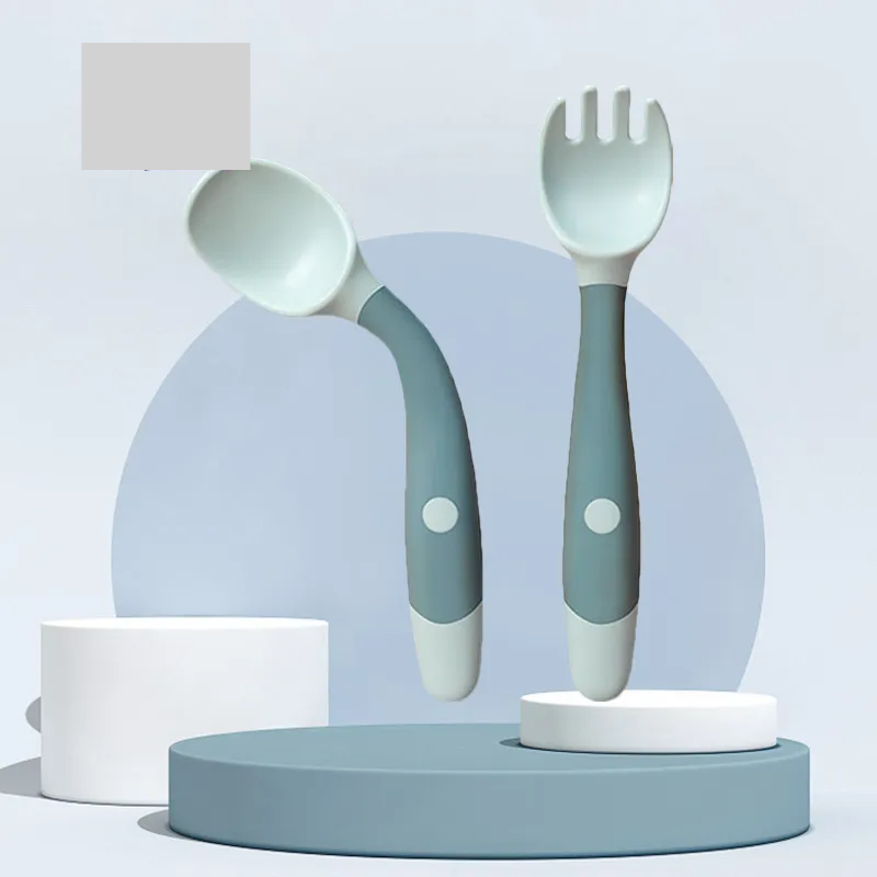 Green silicone toddler fork and spoon, durable and easy for little hands to grip, BPA free