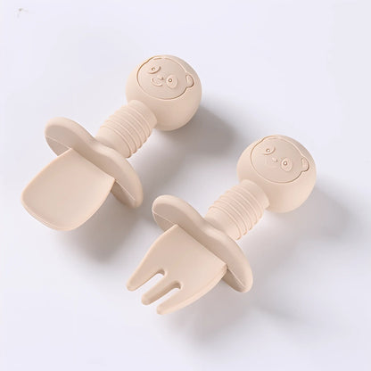 Baby's first cutlery, soft silicone spoon and fork with easy-grip wooden handles