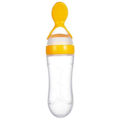 Close-up of silicone spoon on baby squeeze bottle, showing soft tip for gentle infant feeding