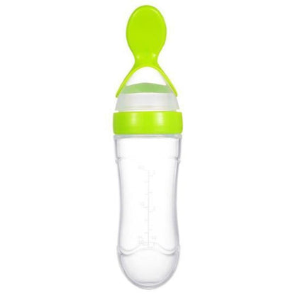Hand holding baby squeeze feeding spoon bottle, demonstrating ergonomic design for easy use