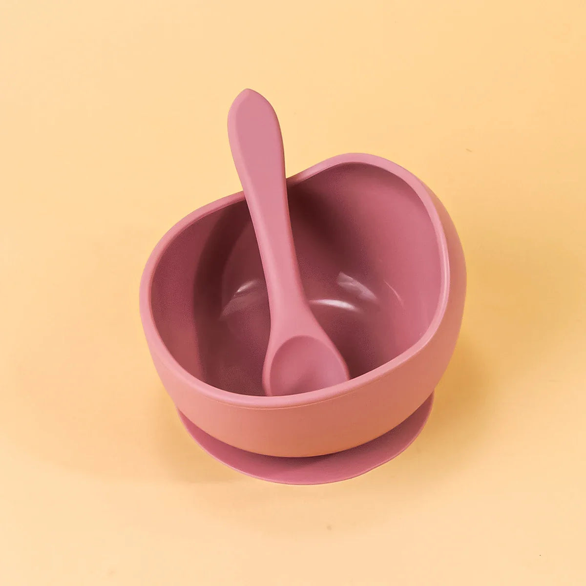 Baby silicone suction bowl, blue, showing strong suction cup feature on a high chair