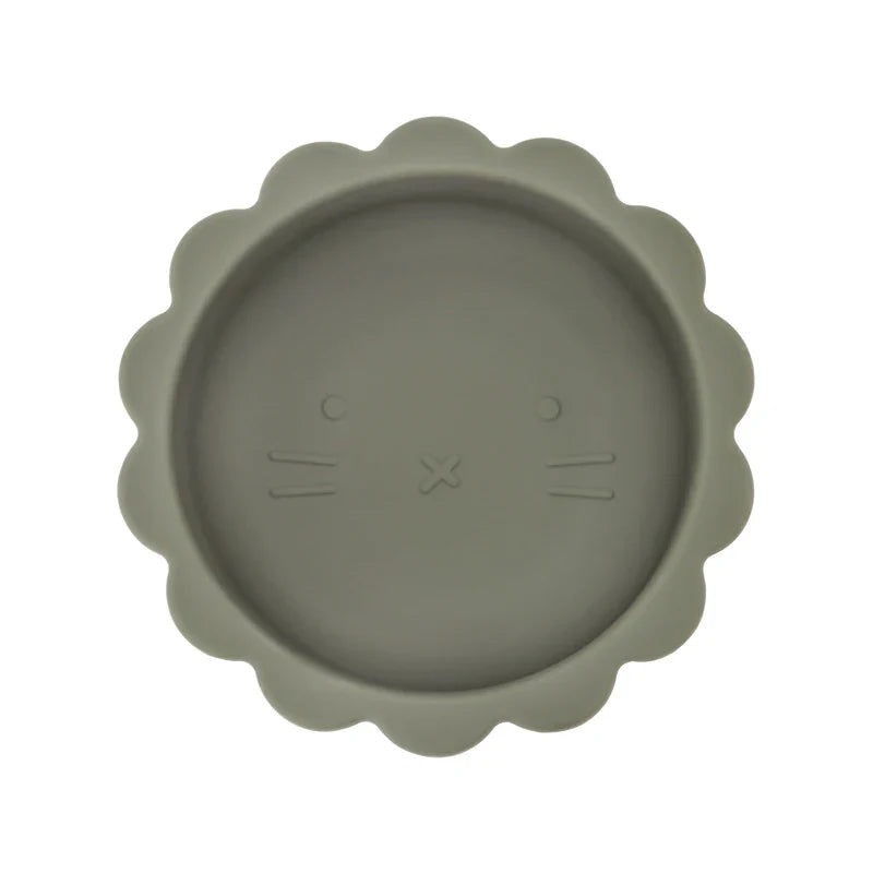 Baby silicone suction bowl on a table, illustrating its non-slip feature