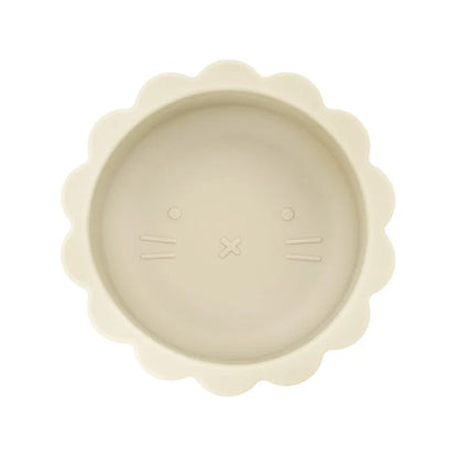 Baby silicone suction bowl with lid alongside a spoon, ready for mealtime