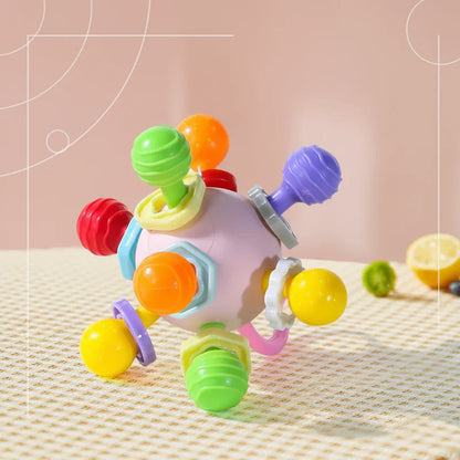 Textured orange baby silicone teether grip ball, promotes sensory exploration and gum relief.