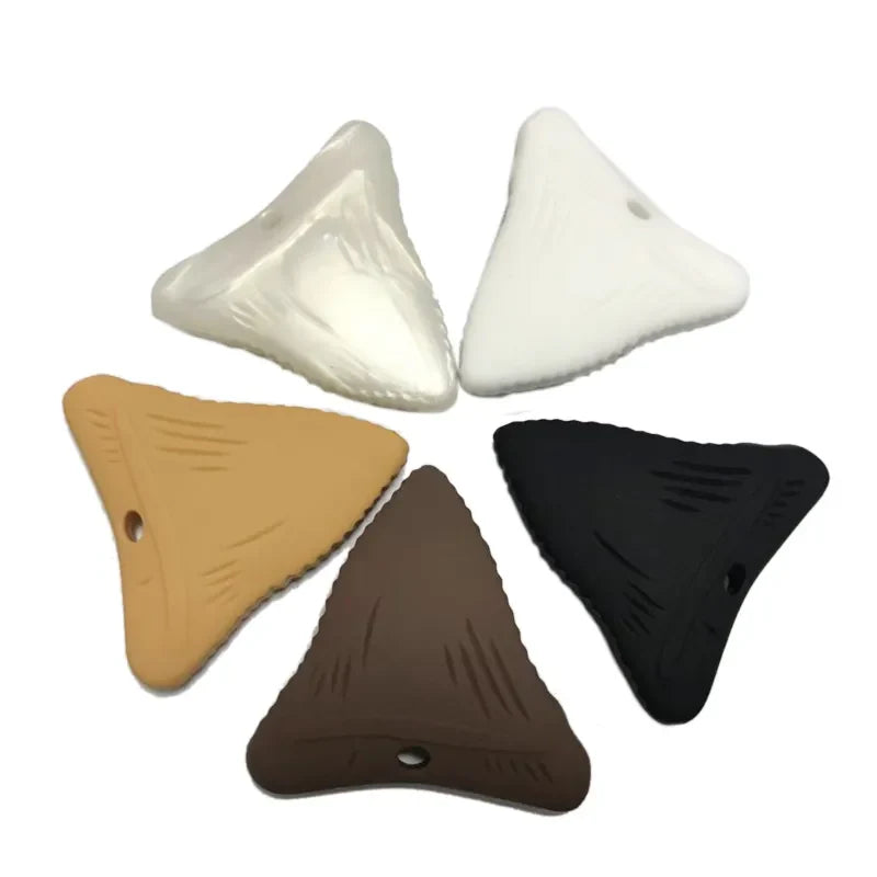 Collection of silicone teething necklaces displayed, showcasing different styles and colors for baby comfort.