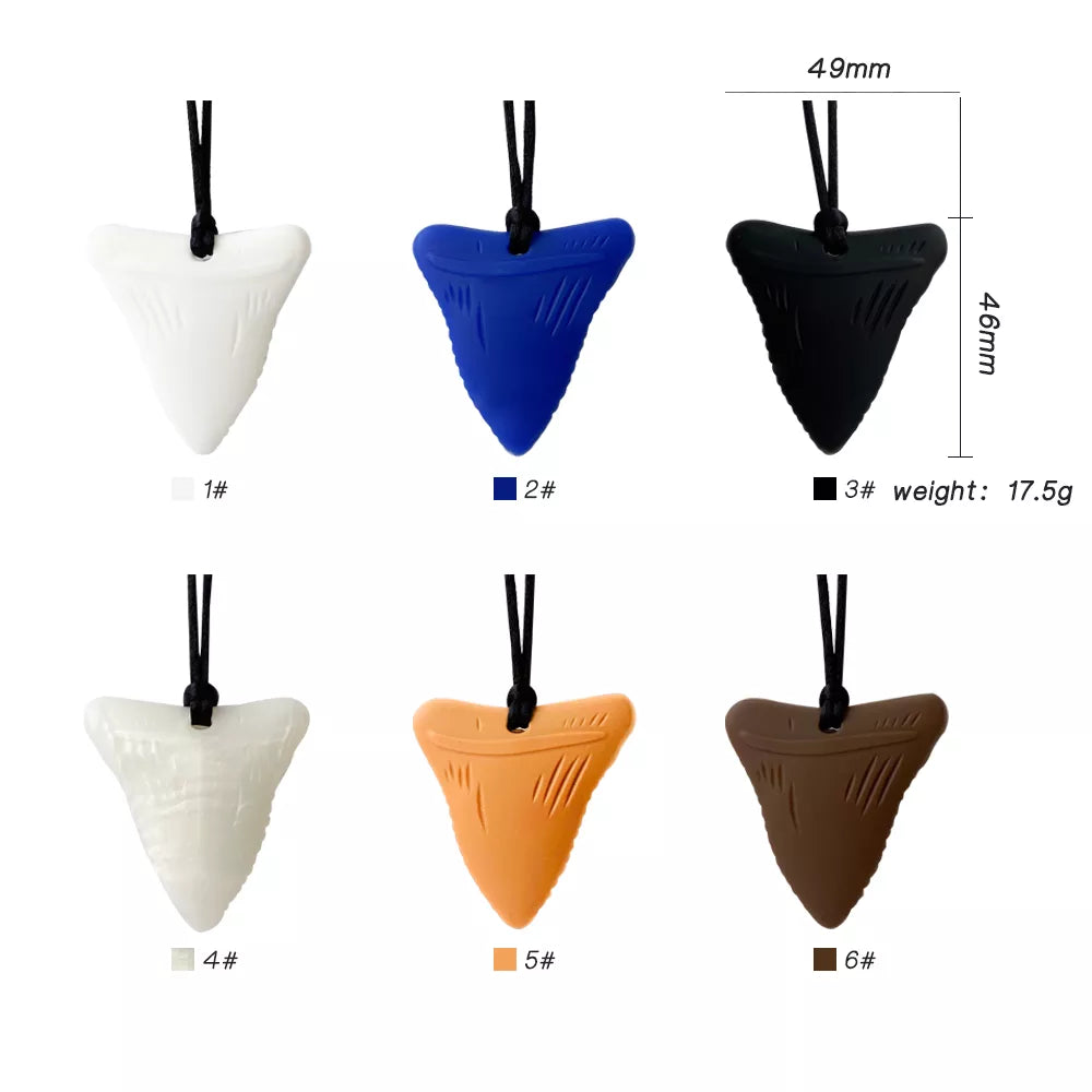 Close-up of a non-toxic silicone teether necklace with various textures, providing infant teething comfort.