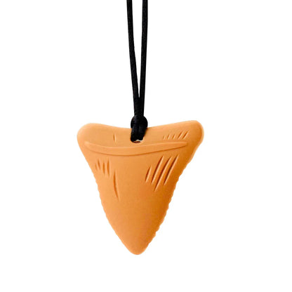 Infant playing with a soft, food-grade silicone teether necklace, promoting independent play.