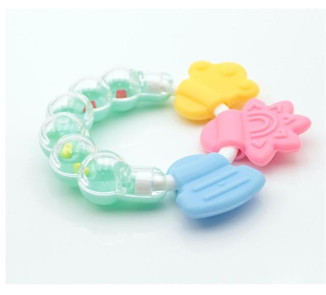 Bundle of colorful silicone baby teether rattles, offering varied textures for infant teething relief.