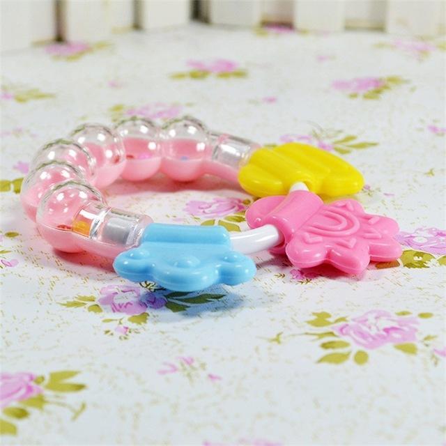 Non-toxic silicone baby teether rattle, a durable and safe chew toy for sensitive infant gums.