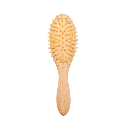 Natural wood baby comb, perfect for detangling and styling delicate infant hair, ergonomic design