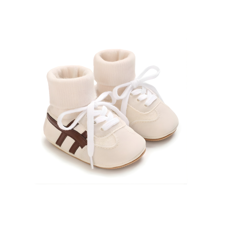 Close-up of soft sole baby footwear, cotton material, designed for infant comfort and anti-slip walking.