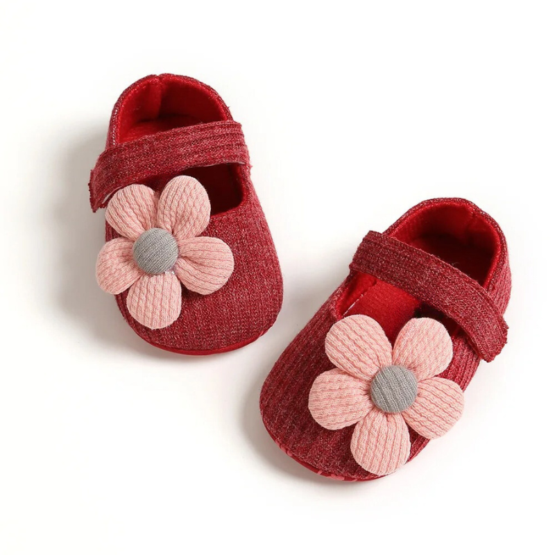 Close-up of a baby's foot in a breathable, soft sole, anti-slip shoe, perfect for infants.