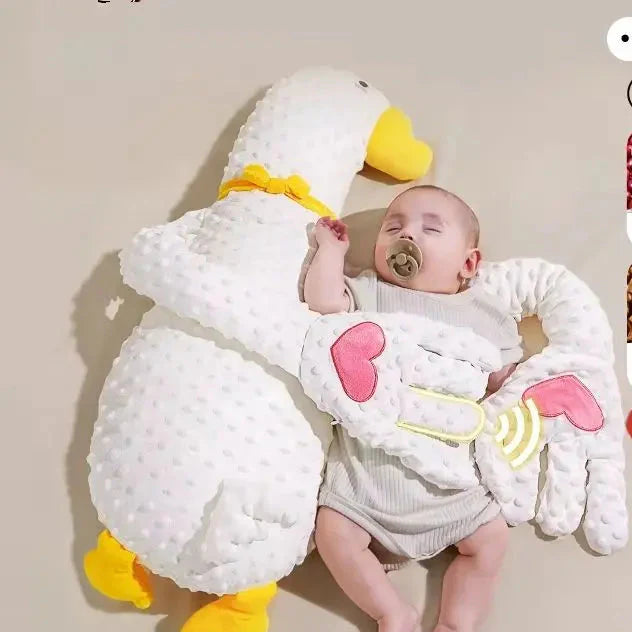 Soft white goose plush sleep aid pillow, perfect crib companion for infants, aids in sleep training.
