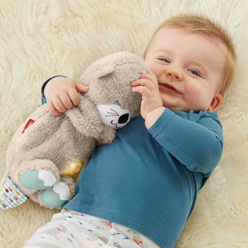 Close-up of baby soothing otter plush, highlighting soft texture and gentle breathing movement