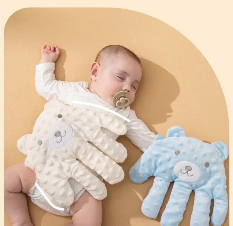 Happy baby interacting with a soft Baby Soothing Patting Pillow, perfect for napping & comfort