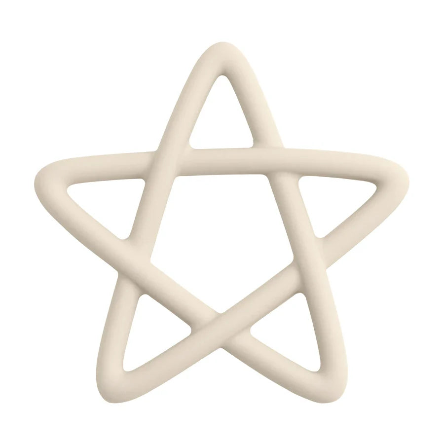 Close-up of a baby's hand grasping a blue star silicone teether, indicating ease of use