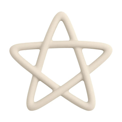 Close-up of a baby's hand grasping a blue star silicone teether, indicating ease of use