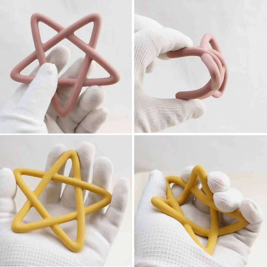 Yellow star silicone teether with textured surfaces, offering effective gum relief for infants