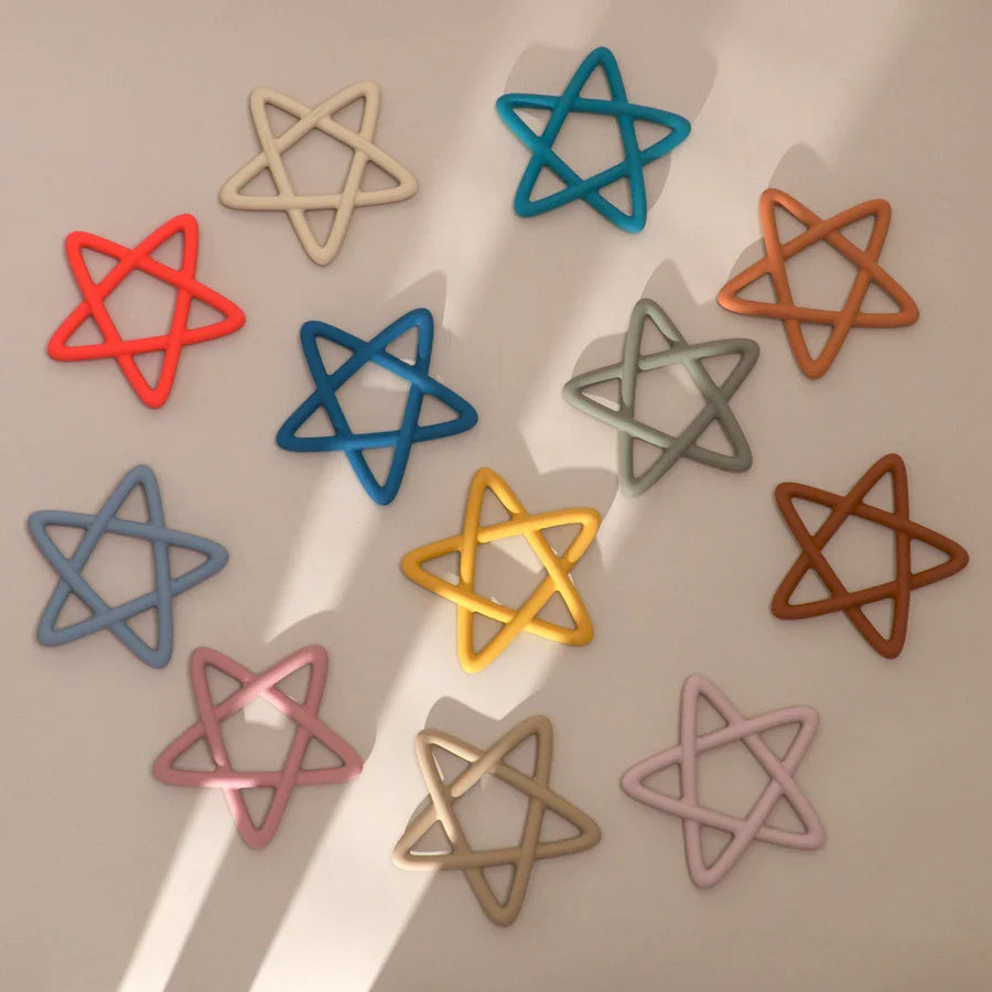 A collection of colorful star silicone teething toys, essential baby essentials for soothing gums