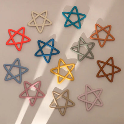 A collection of colorful star silicone teething toys, essential baby essentials for soothing gums