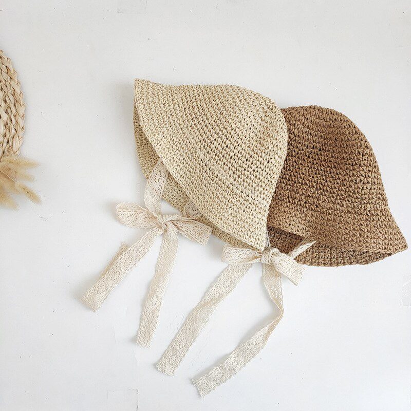 Adorable baby straw hat, an essential summer accessory for infants on sunny adventures.