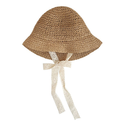 Cute infant straw hat offering UV protection, ideal for babies at the beach or park.
